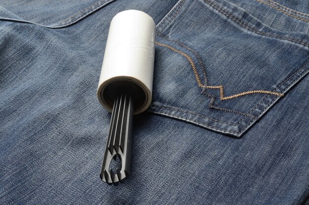 A pair of jeans with a uniquely designed hem with decorative stitching, showcasing a creative alteration to adjust the length while adding a personal touch.