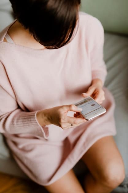 Close-up of a woman's hands selecting and scrolling through the SHEIN mobile app on her smartphone, showcasing the variety of workwear options available such as blazers, blouses, and skirts. The focus is on the ease of navigating the app and the abundance of choices.
