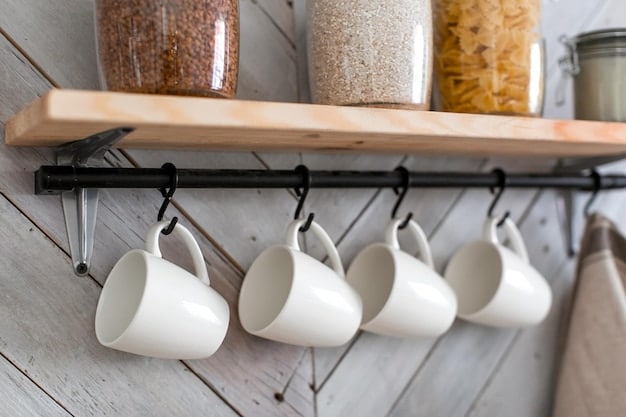 Well styled coffee station in kitchen with tiered shelf organizer from SHEIN, mugs hanging on hooks, coffee beans in labeled jars.
