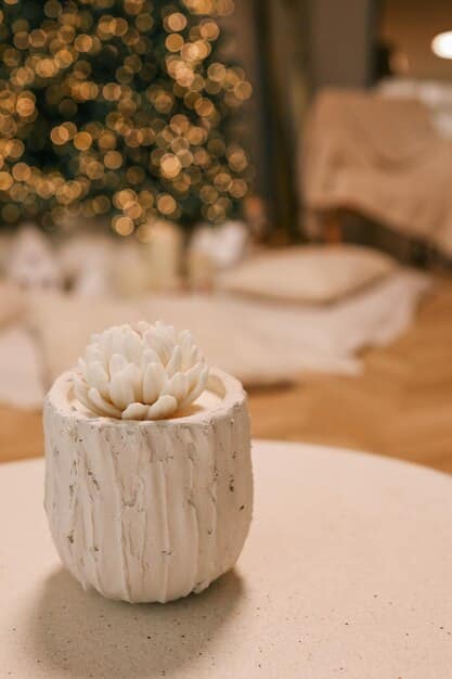A close-up of a coffee table styled with SHEIN decorative trays, candles, and a small faux plant. The lighting is soft and inviting.