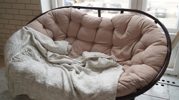 A close-up of affordable SHEIN cushions and a throw blanket on a comfortable reading chair, with a book open on the armrest. The lighting is soft and inviting, highlighting the textures of the fabric and creating a cozy atmosphere.