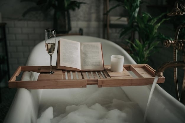 A bathtub filled with bubbly water, with a pink bath bomb dissolving and releasing fragrance and color. There's a glass of wine and a book on a small wooden table next to the tub.