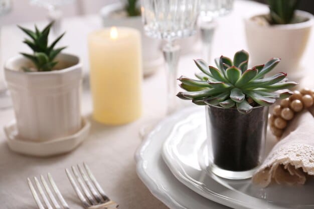 A close-up of a SHEIN dining table centerpiece featuring geometric candle holders, faux succulent plants, and a knitted table runner, creating a modern and cozy vibe.