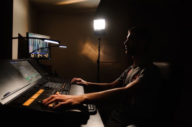 A video editor working in a dark room with soft, neutral lighting. The monitor is the primary light source in the room.