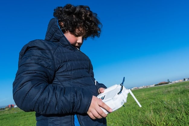 A person using a tablet to plan a drone flight, with a map displayed on the screen showing the flight route and potential obstacles. Sunlight is reflecting on the tablet.